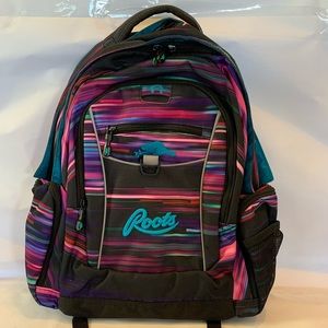 ROOTS backpack. NEW. Never used. Purple with striped accents. Key chain holder.